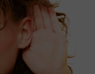 Close-up of hand behind ear